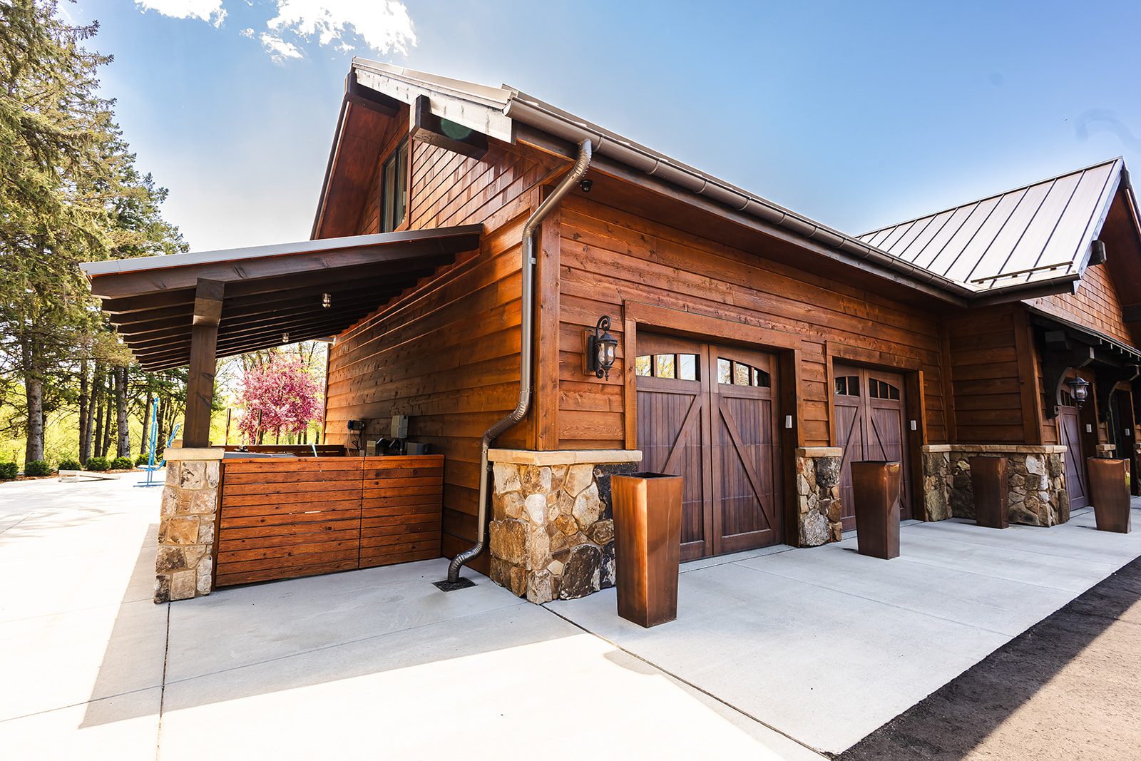 Rustic wooden garage with stone accents