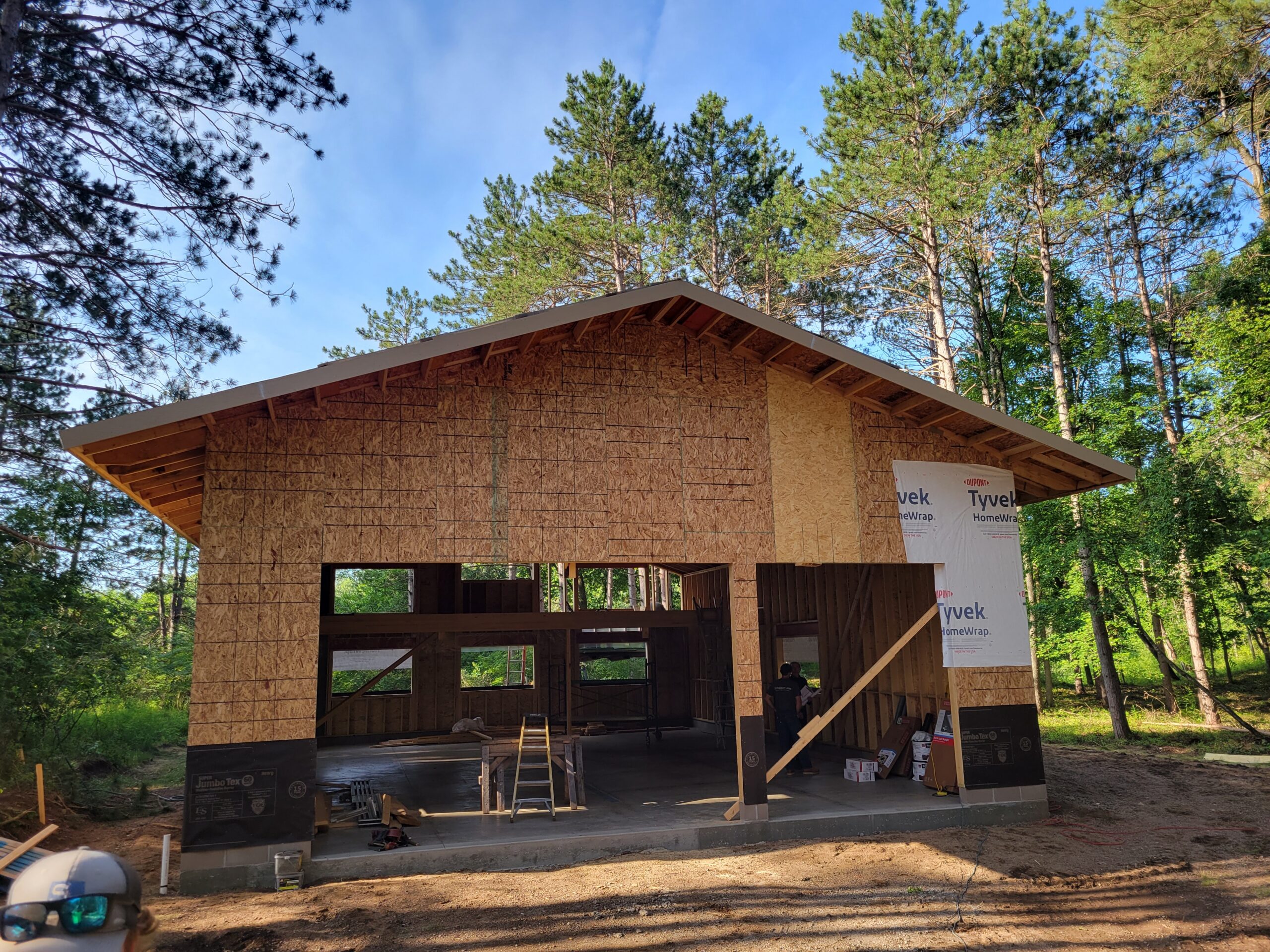 Wood frame garage under construction in forest