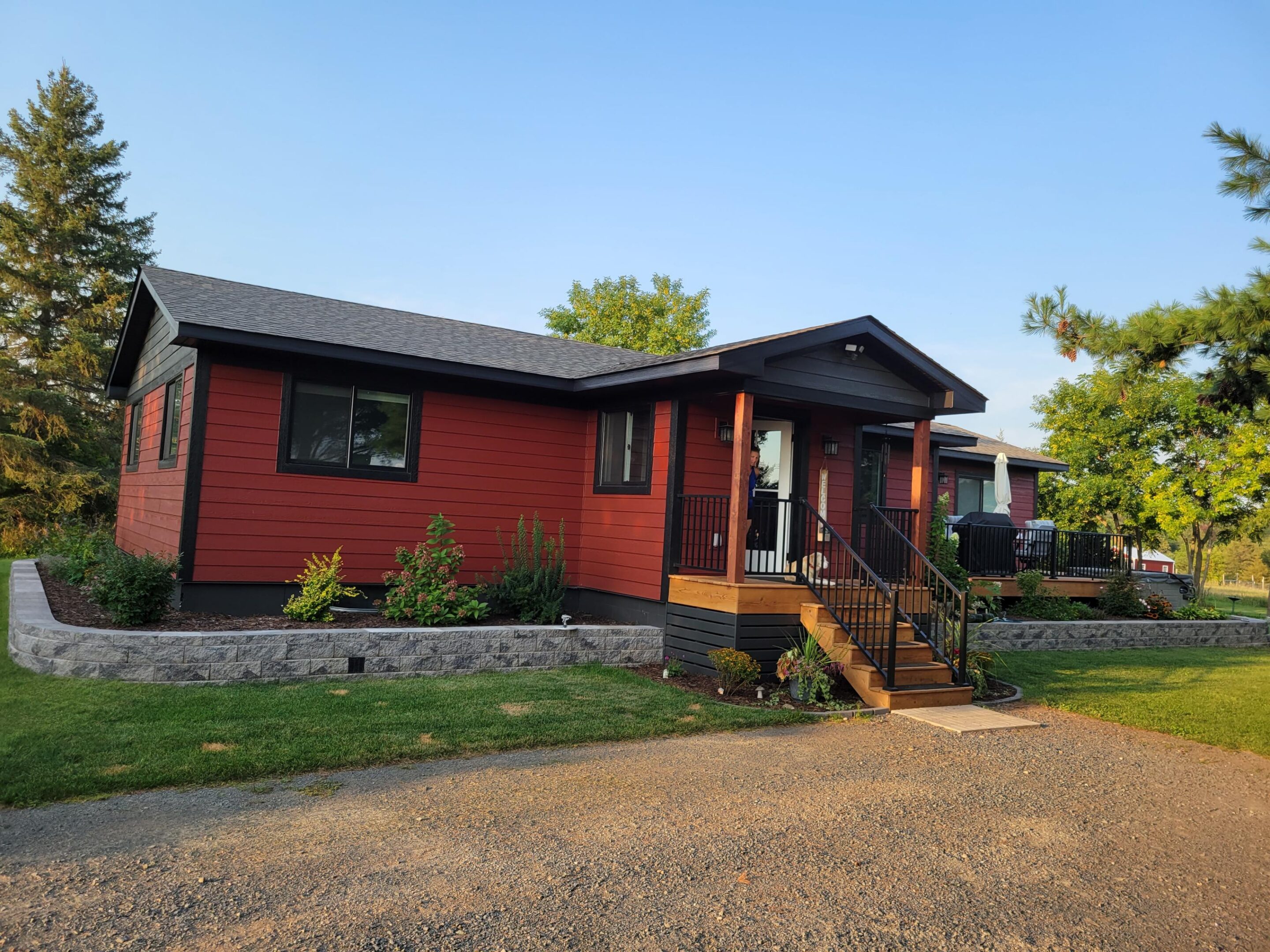 Red single story house with front porch