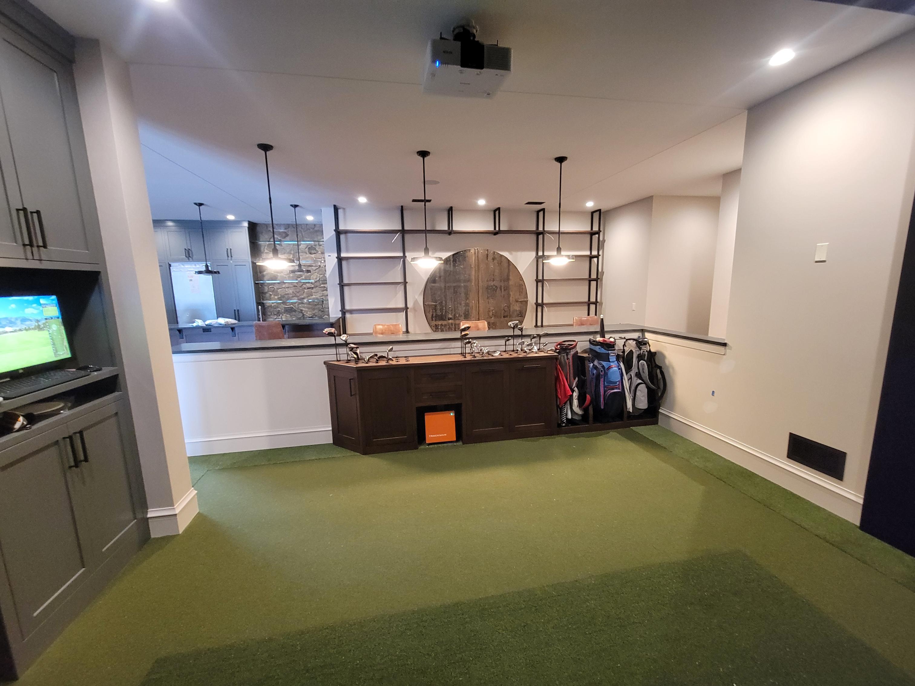 Basement indoor putting green and bar