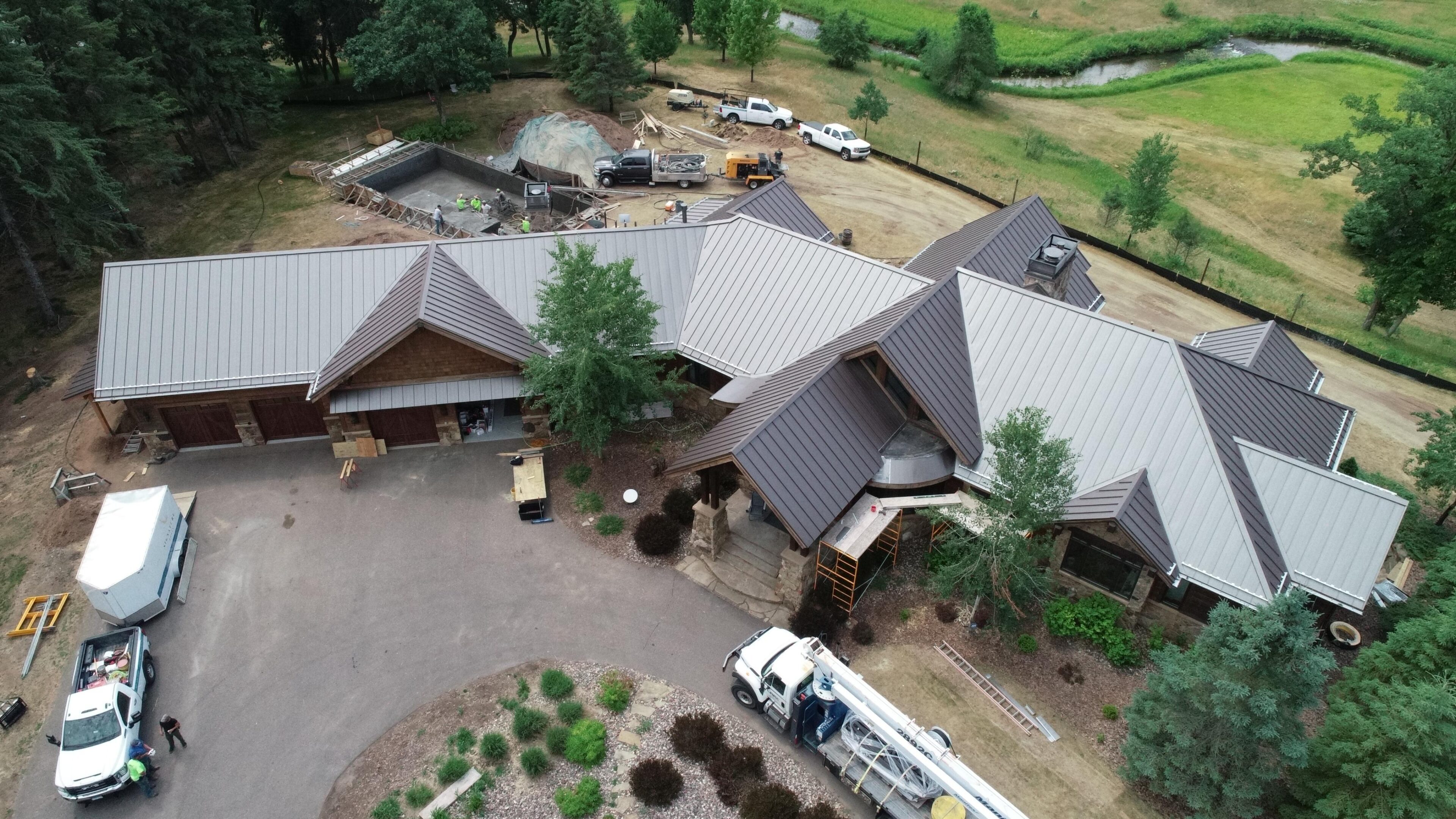 Aerial view of large house with metal roof