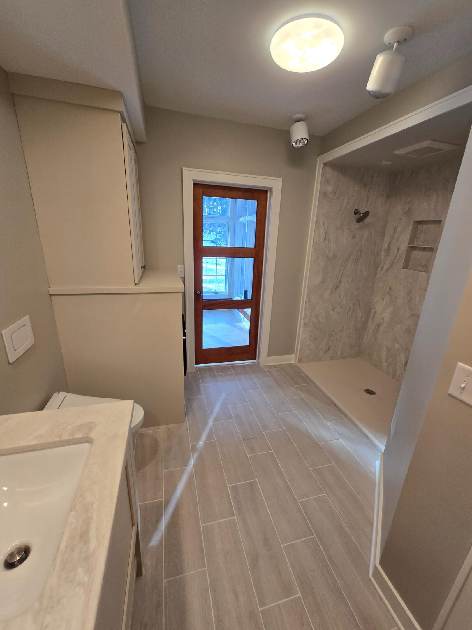 Modern tiled bathroom with walk-in shower