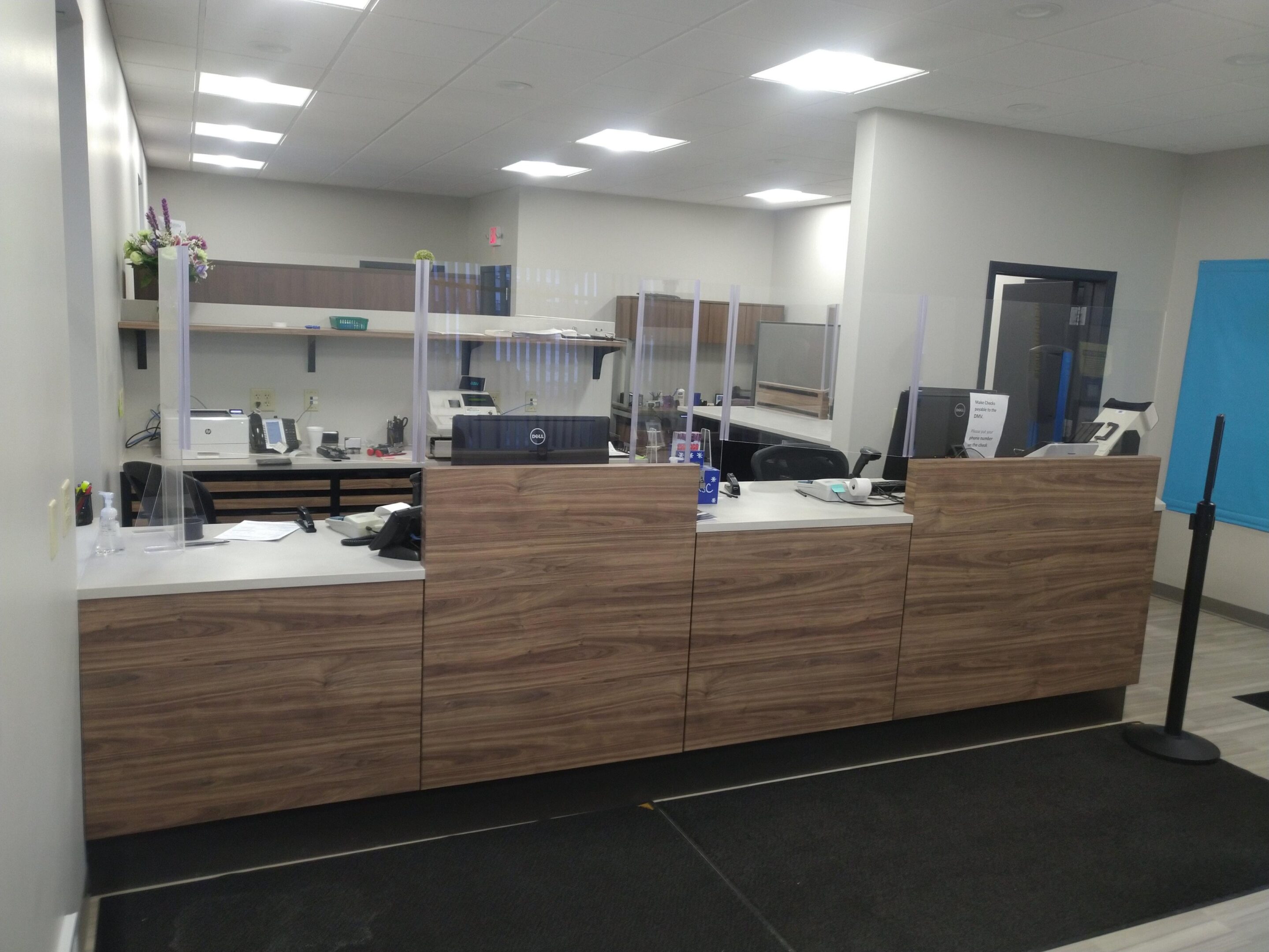 Modern office reception desk with plexiglass dividers