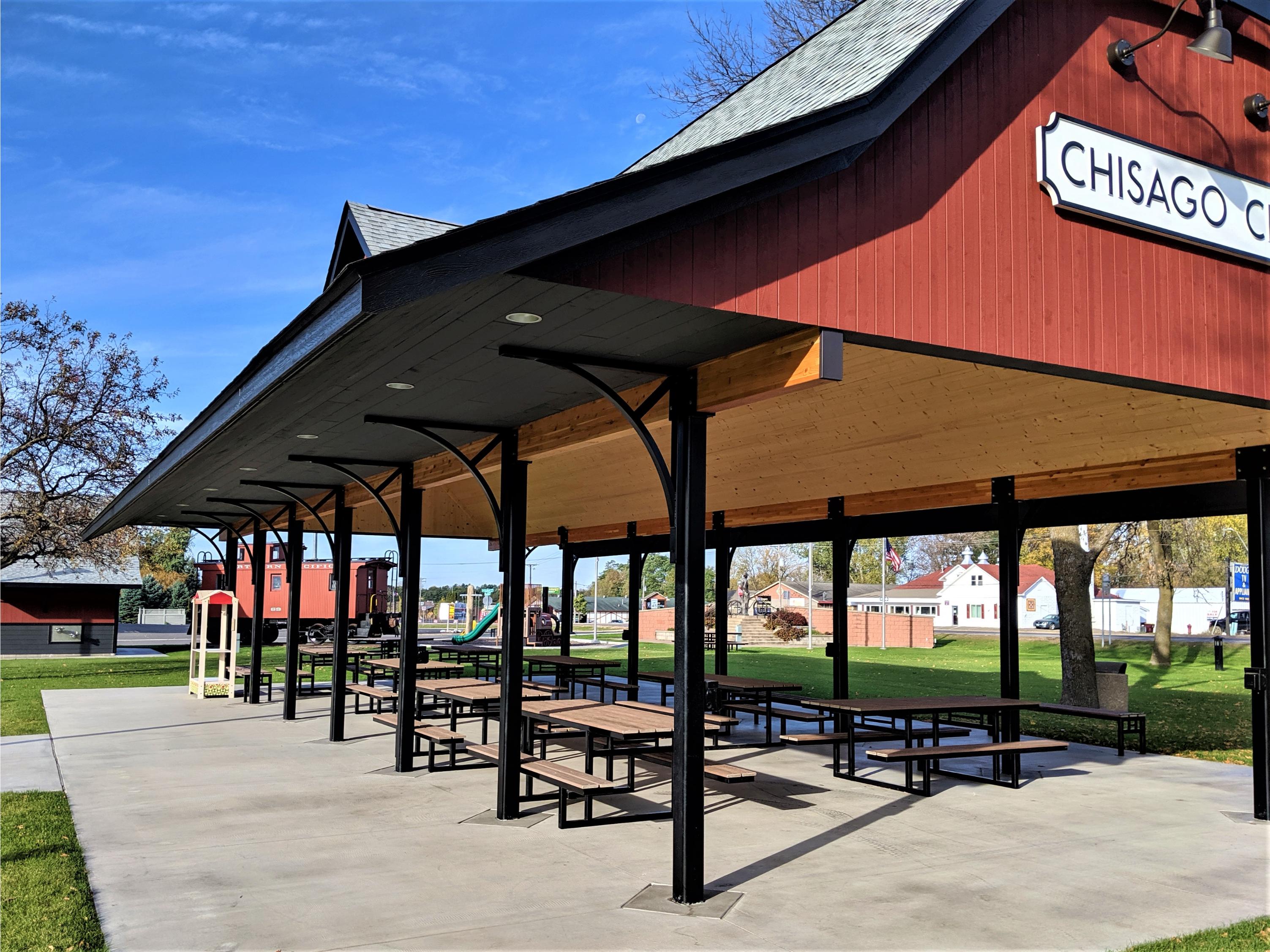 Covered picnic pavilion with tables in park