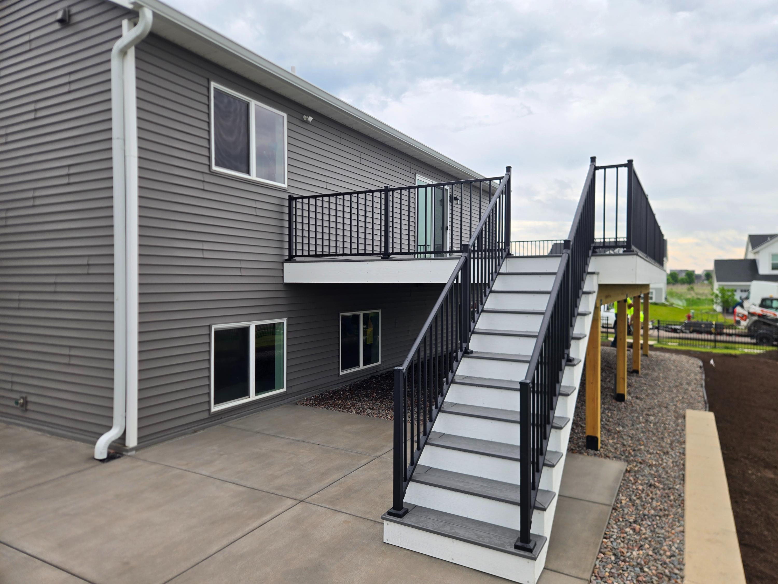 Gray house with elevated deck and stairs