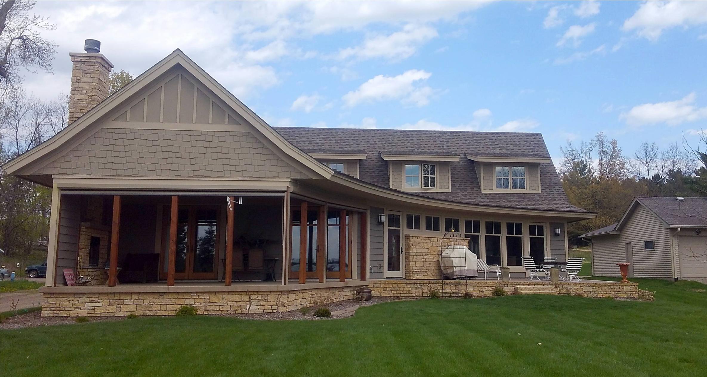 Spacious stone-faced house with covered porch