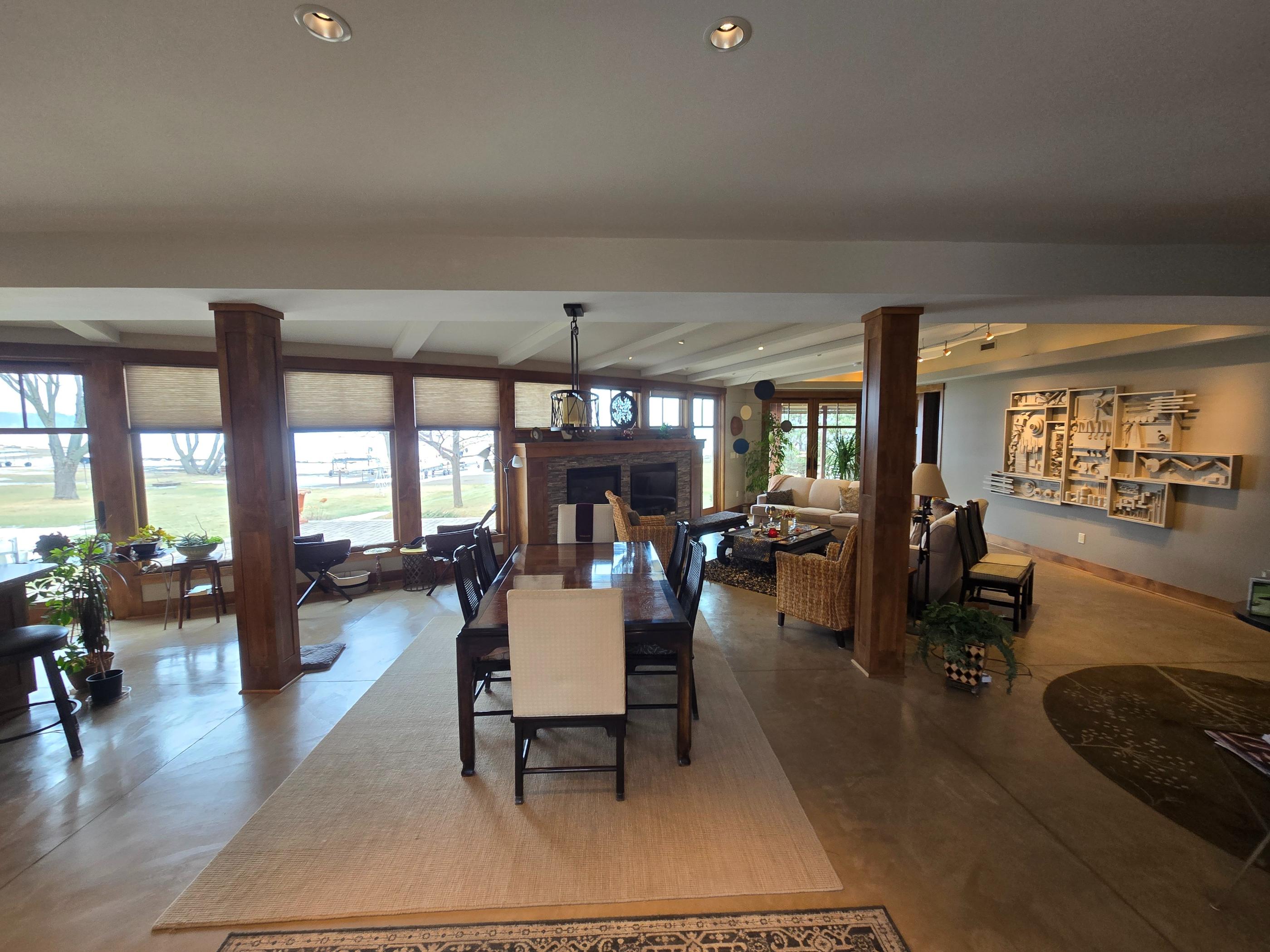 Open plan living and dining room with fireplace