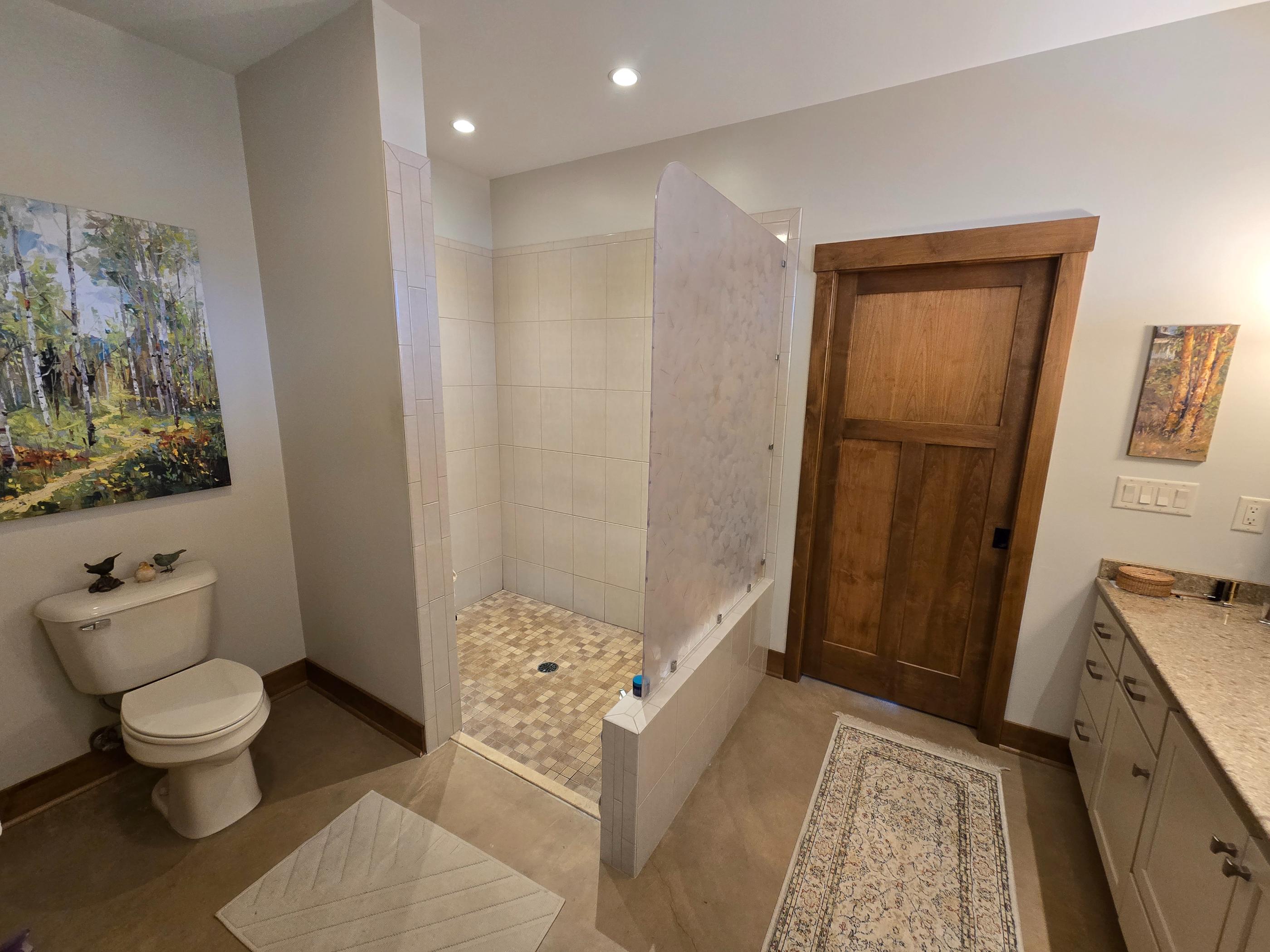 Modern bathroom with walk-in tiled shower