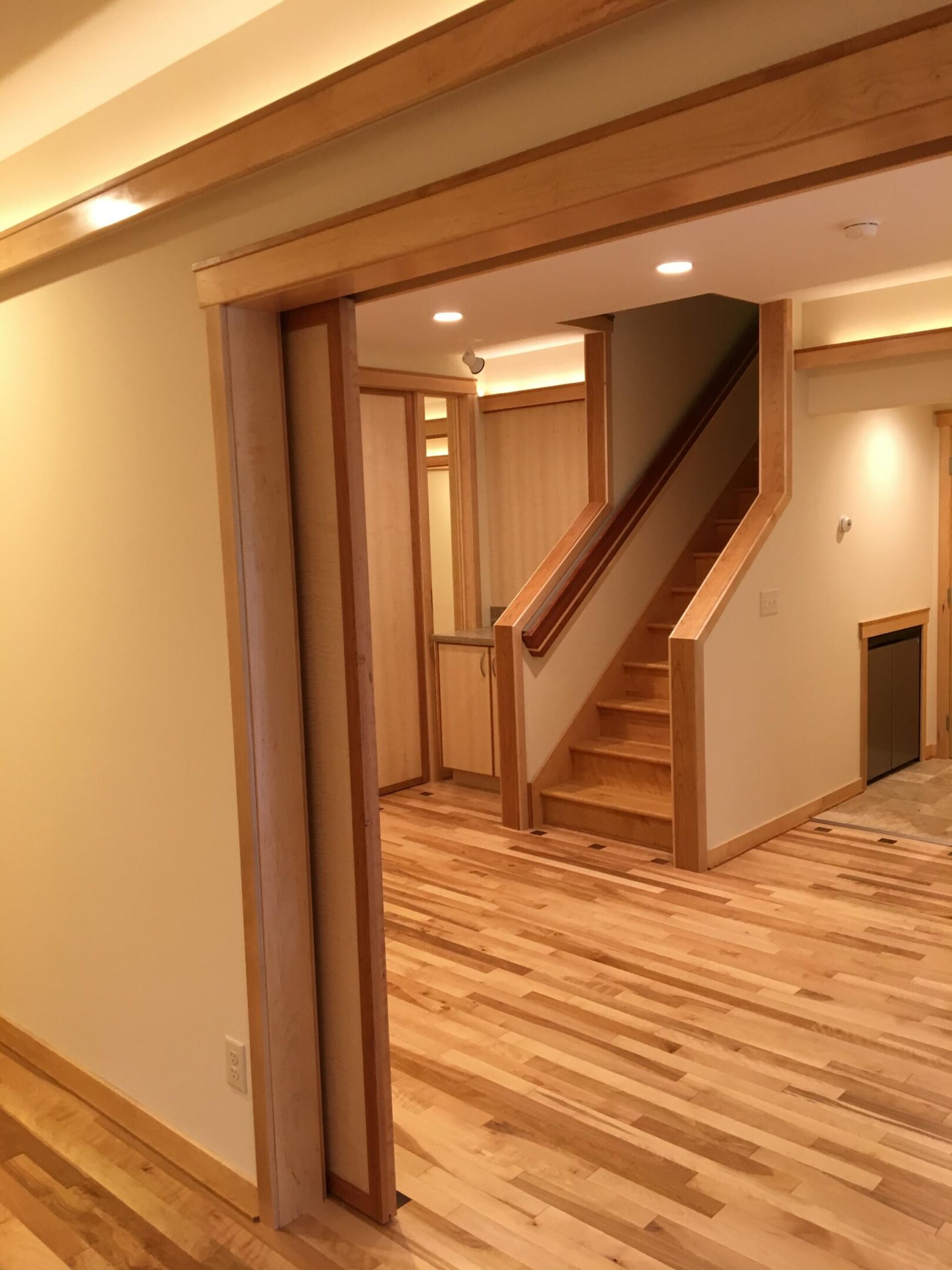 Light wood interior with stairs and hardwood floor