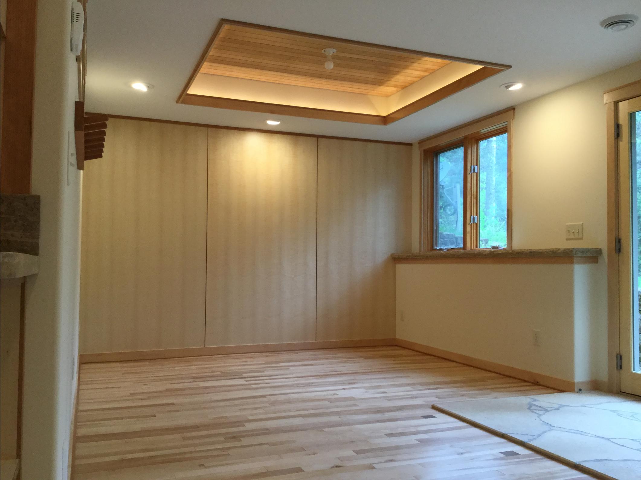 Empty room with wood floors and coffered ceiling