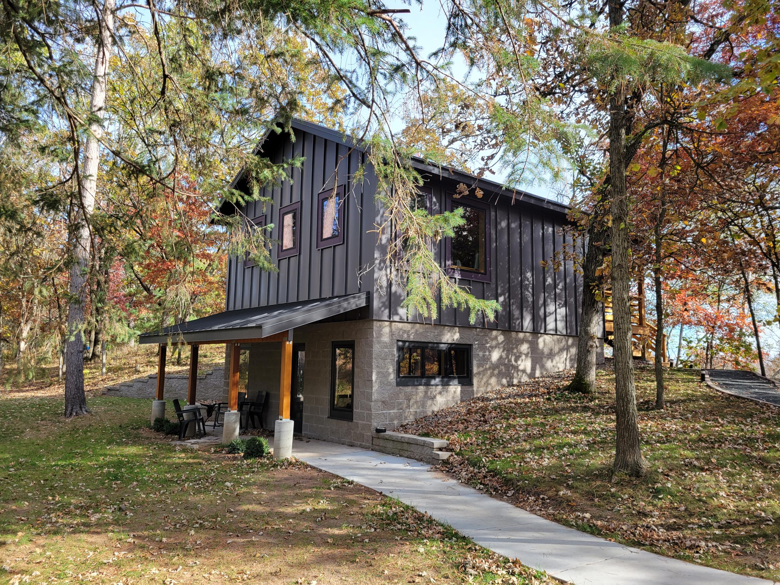 Modern two-story cabin in autumn woods