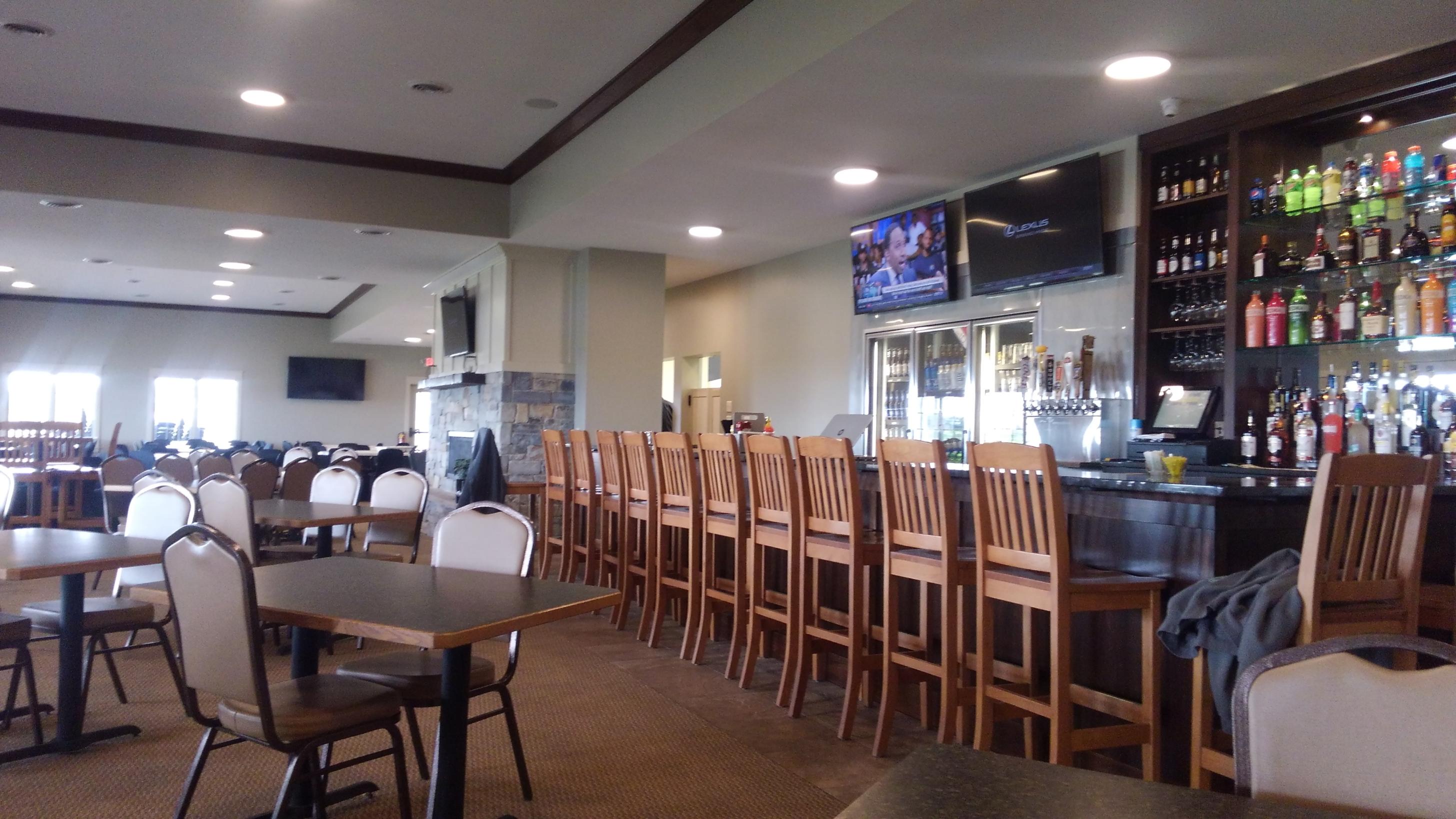 Empty restaurant bar with wooden stools