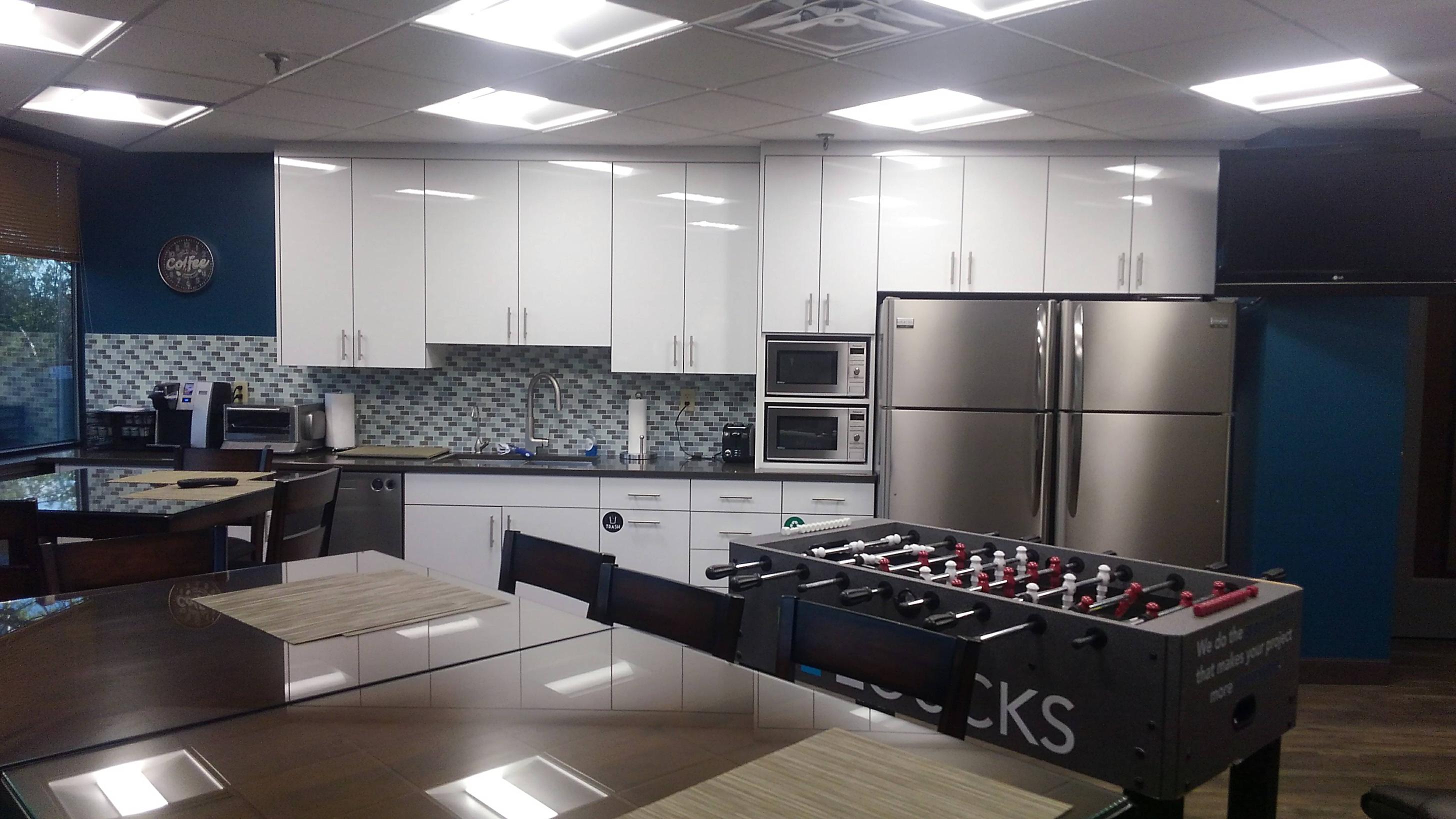 Modern office kitchen with foosball table