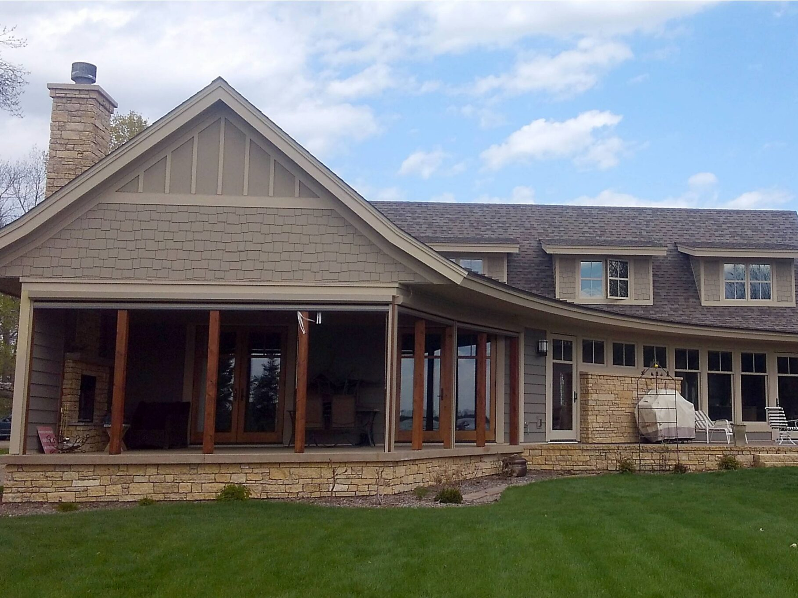 Large stone house with covered porch